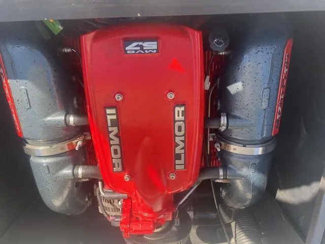 Slide: The Image of 2013 MasterCraft X-10 Ilmor engine, red cover, dual exhaust, powerful marine performance. - 4