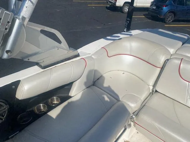 Slide: The Image of 2013 MasterCraft X-10 boat interior with white leather seating and cup holders. - 5