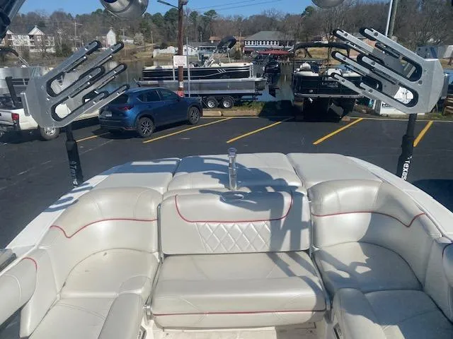 Slide: The Image of 2013 MasterCraft X-10 boat interior with white seating and wakeboard racks. - 7