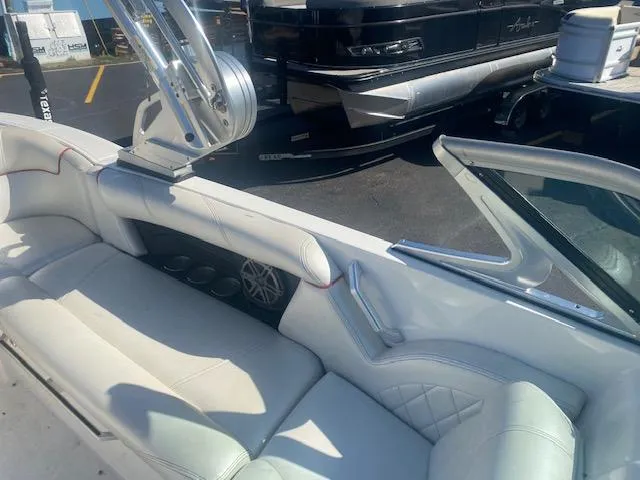Slide: The Image of 2013 MasterCraft X-10 boat interior with white seating and speaker system. - 8