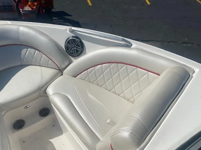 Slide: The Image of 2013 MasterCraft X-10 boat interior with white leather seats and speaker. - 9