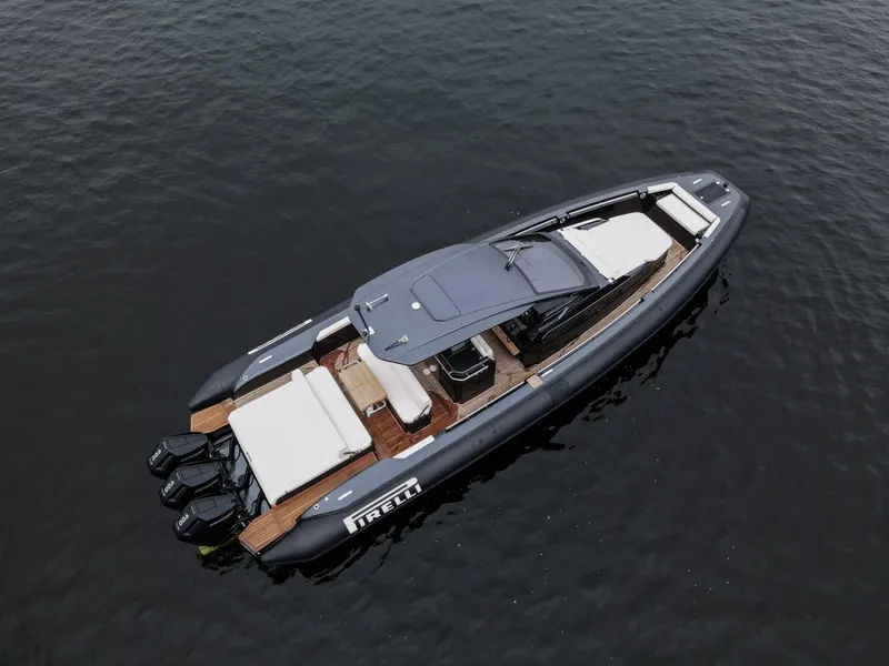 Slide: The Image of 2024 Pirelli 42 OB luxury boat on calm water, aerial view. - 3