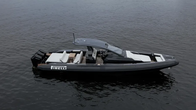 Slide: The Image of 2024 Pirelli 42 OB luxury boat on calm water, side view. - 4