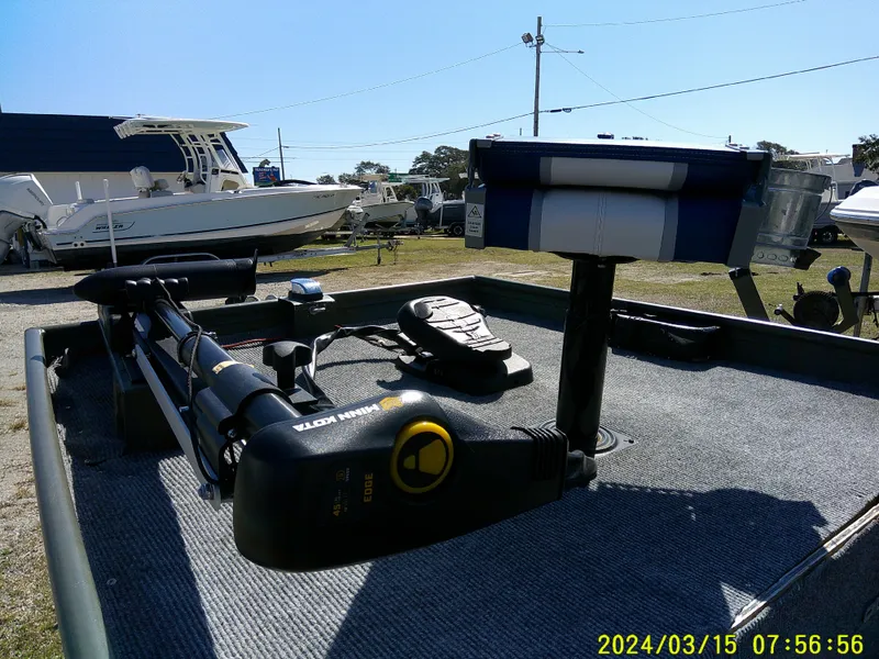 Slide: The Image of 2018 Alumacraft 1648 Jon boat with trolling motor and equipment on deck. - 11