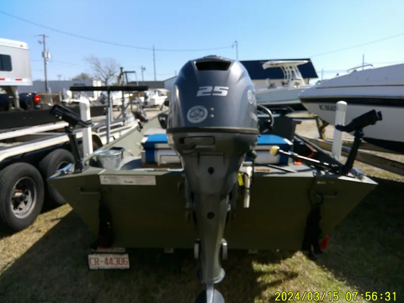 Slide: The Image of 2018 Alumacraft 1648 Jon boat with 25HP motor, parked outdoors. - 6