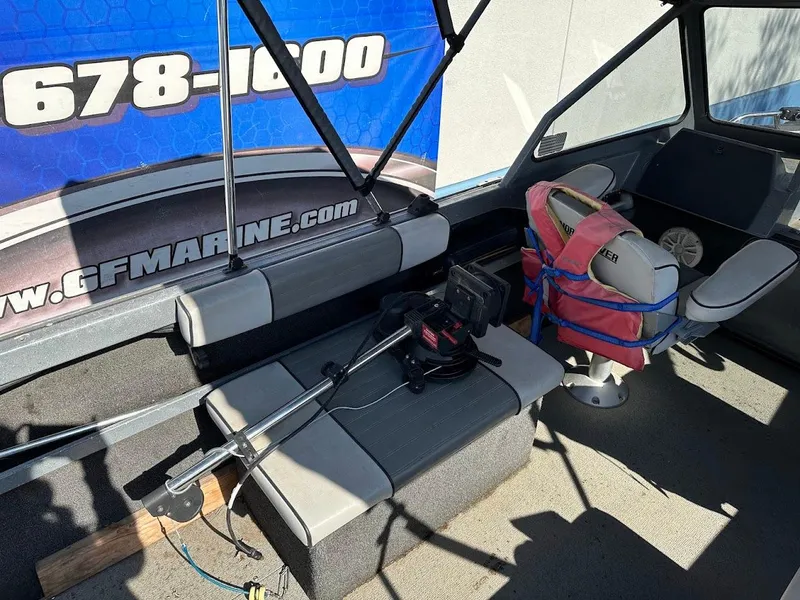 Slide: The Image of Interior of a 2000 North River 19 Sportster boat with seating and equipment. - 19