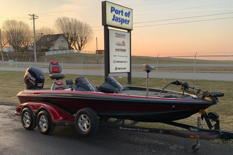 Slide: The Image of 2006 Ranger Z20 Comanche boat at Port of Jasper during sunset. - 1