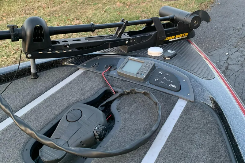 Slide: The Image of 2006 Ranger Z20 Comanche boat dashboard with navigation equipment and trolling motor. - 6