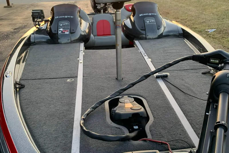 Slide: The Image of 2006 Ranger Z20 Comanche boat deck with dual motors and fishing equipment. - 7