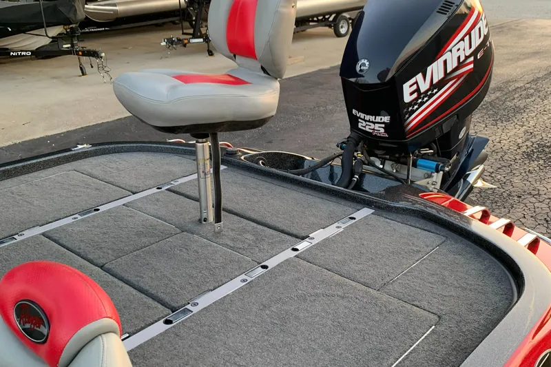 Slide: The Image of 2006 Ranger Z20 Comanche boat with Evinrude 225 engine and red-gray seating. - 8
