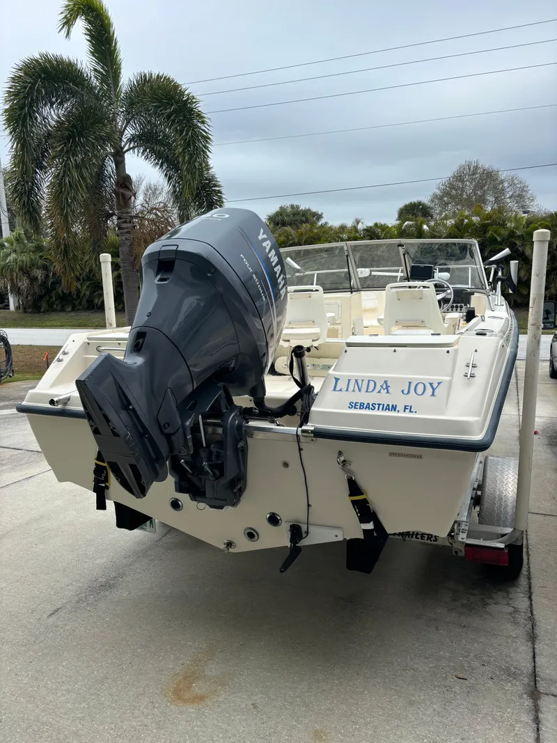 Slide: The Image of Key West 2020 Dual Console boat, 2004 model, with Yamaha outboard motor, parked outdoors. - 3