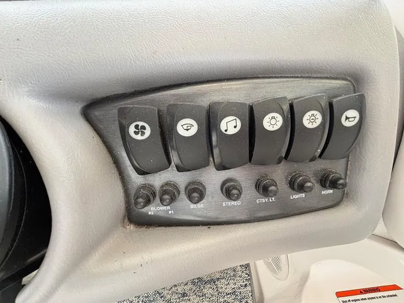 Slide: The Image of Control panel of a 2004 Yamaha Boats 230 SX with labeled switches and buttons. - 15