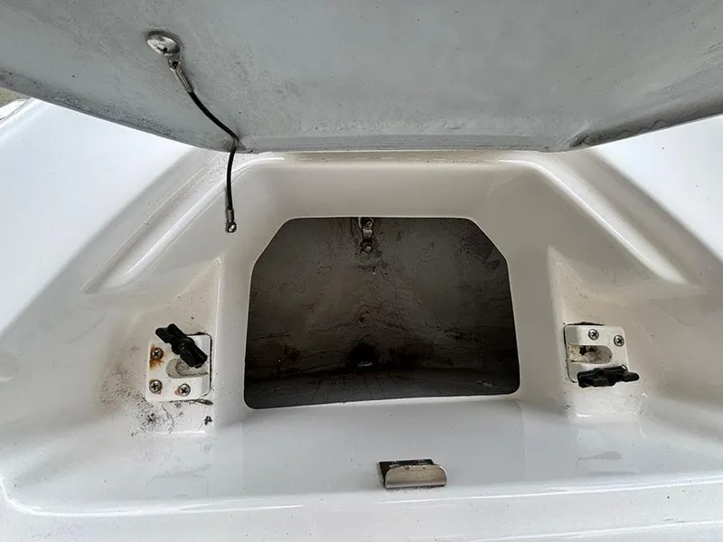 Slide: The Image of Open storage compartment on a 2004 Yamaha Boats 230 SX. - 18