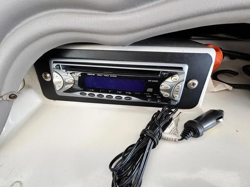 Slide: The Image of JVC stereo system in a 2004 Yamaha Boats 230 SX with a coiled cable. - 9