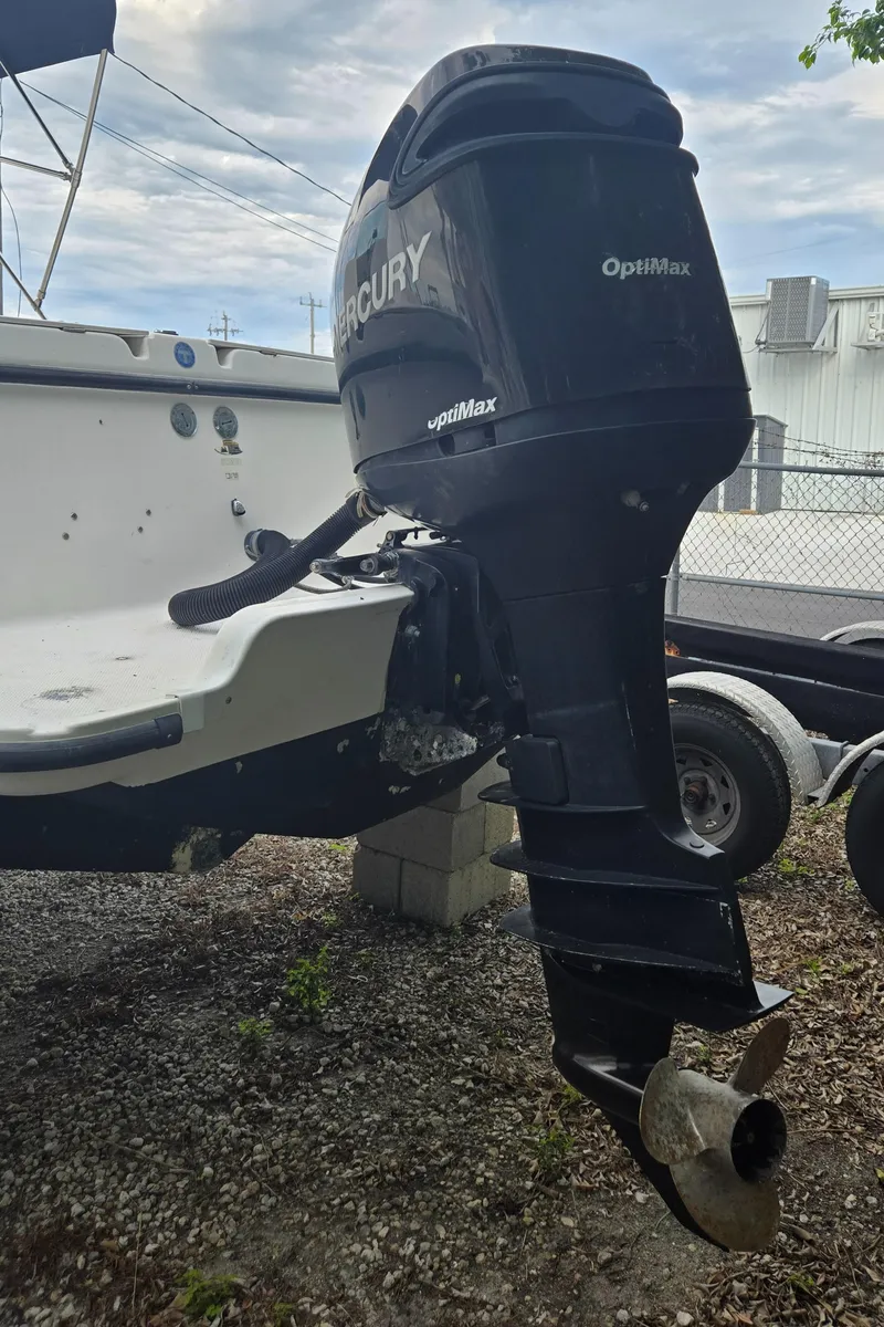 Slide: The Image of 1998 Trophy 2503 Center Console with Mercury OptiMax outboard motor. - 15