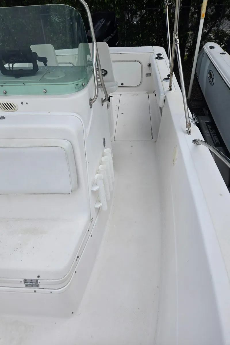 Slide: The Image of 1998 Trophy 2503 Center Console boat interior with seating and steering console. - 20