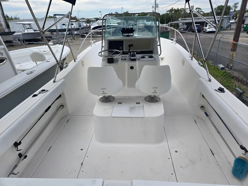 Slide: The Image of 1998 Trophy 2503 Center Console boat interior with dual seats and steering console. - 4
