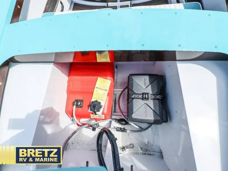Slide: The Image of 2025 Starcraft 57 SKI CHAMP boat interior with fuel tank and battery compartment. - 18