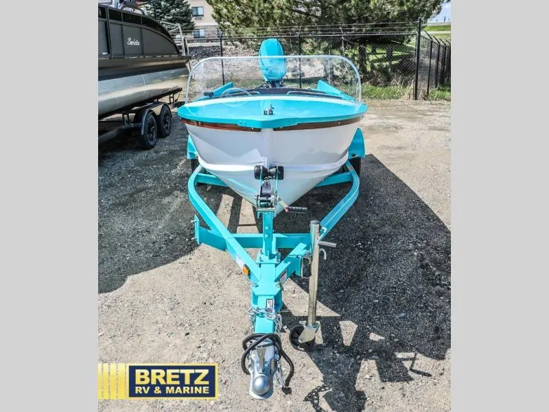 Slide: The Image of 2025 Starcraft 57 SKI CHAMP boat in vibrant blue, displayed at Bretz RV & Marine. - 2