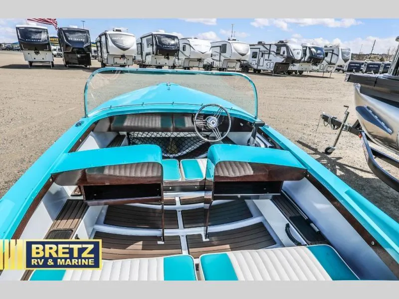 Slide: The Image of 2025 Starcraft 57 SKI CHAMP boat with turquoise interior at Bretz RV & Marine dealership. - 8