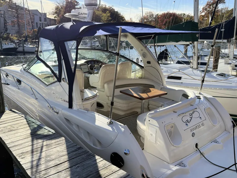 Slide: The Image of 2007 Sea Ray 340 Sundancer docked, featuring a spacious cockpit and elegant design. - 10