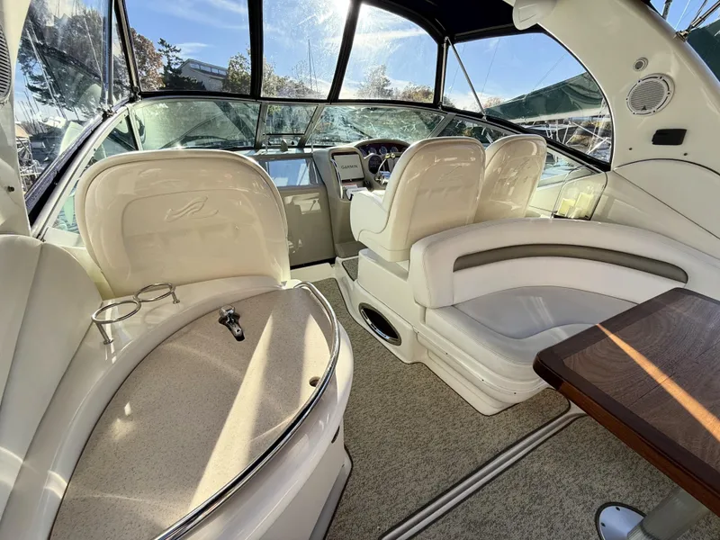 Slide: The Image of 2007 Sea Ray 340 Sundancer interior with plush seating and modern dashboard. - 11