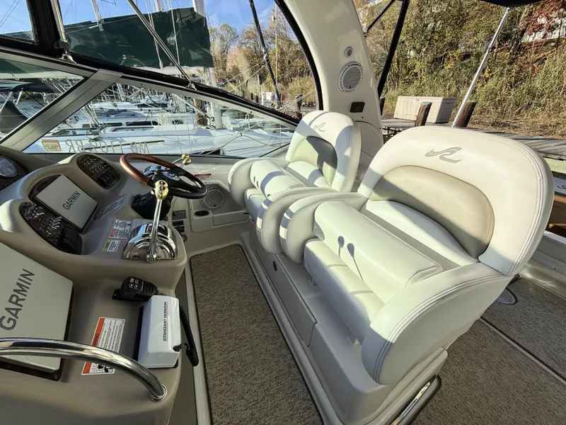 Slide: The Image of 2007 Sea Ray 340 Sundancer cockpit with Garmin navigation and plush seating. - 17
