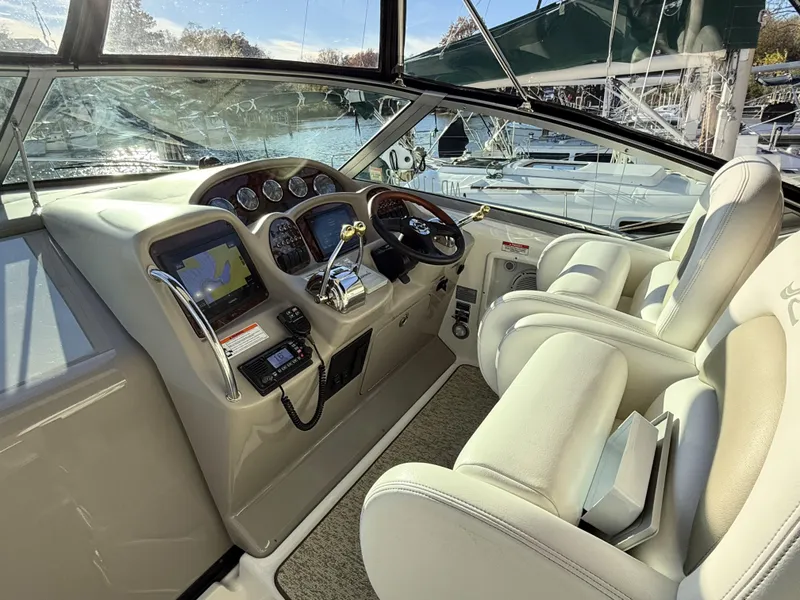 Slide: The Image of Interior cockpit of 2007 Sea Ray 340 Sundancer with navigation equipment and plush seating. - 18