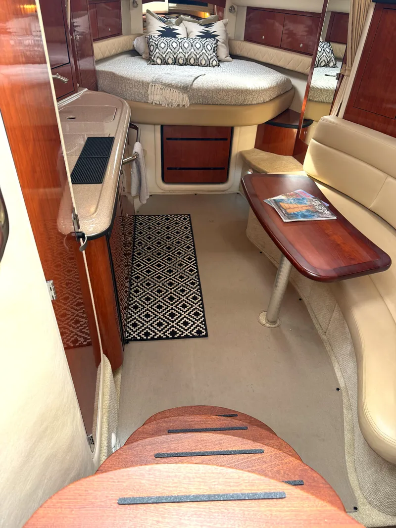 Slide: The Image of Interior of 2007 Sea Ray 340 Sundancer yacht with cozy cabin and elegant furnishings. - 21