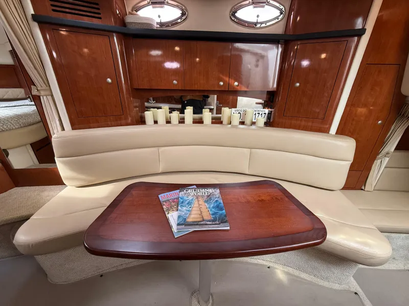 Slide: The Image of Interior of 2007 Sea Ray 340 Sundancer with elegant seating and wooden table. - 24