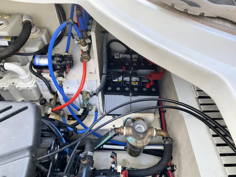 Slide: The Image of Engine compartment of a 2007 Sea Ray 340 Sundancer with visible battery and wiring. - 37