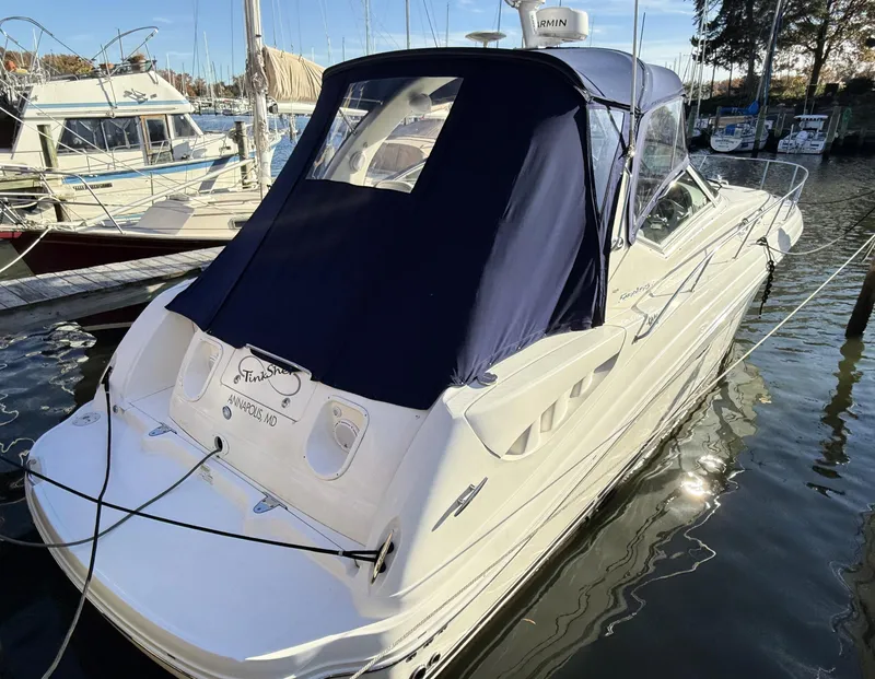 Slide: The Image of 2007 Sea Ray 340 Sundancer docked at marina with blue canopy. - 4