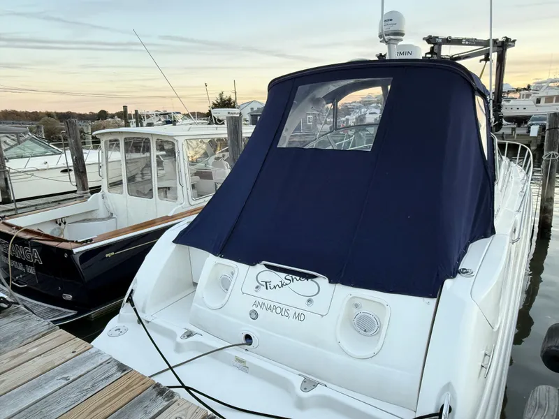 Slide: The Image of 2007 Sea Ray 340 Sundancer docked at marina, Annapolis, MD, with blue canvas cover. - 7
