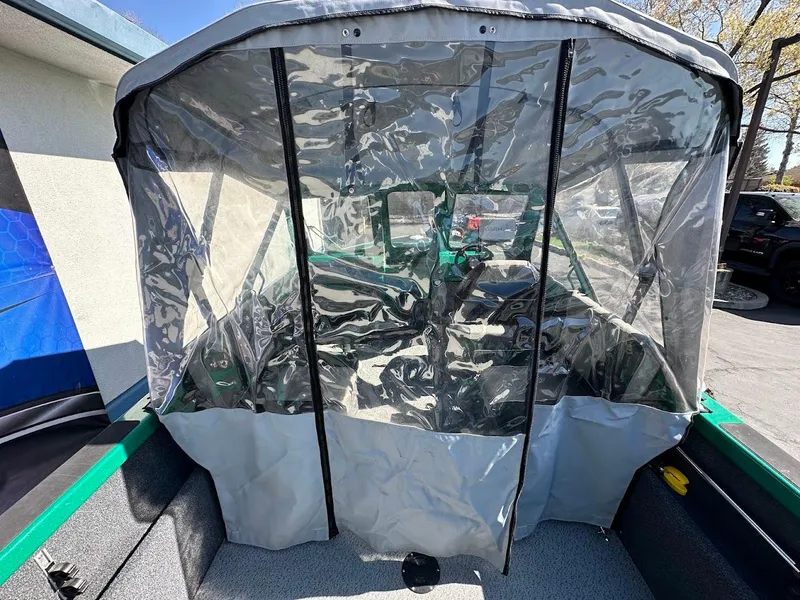 Slide: The Image of 2023 Weldcraft 18 Angler Sport boat with protective canopy and clear vinyl enclosure. - 17