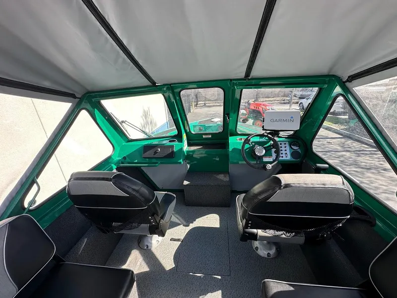 Slide: The Image of Interior of 2023 Weldcraft 18 Angler Sport boat with modern dashboard and seating. - 19