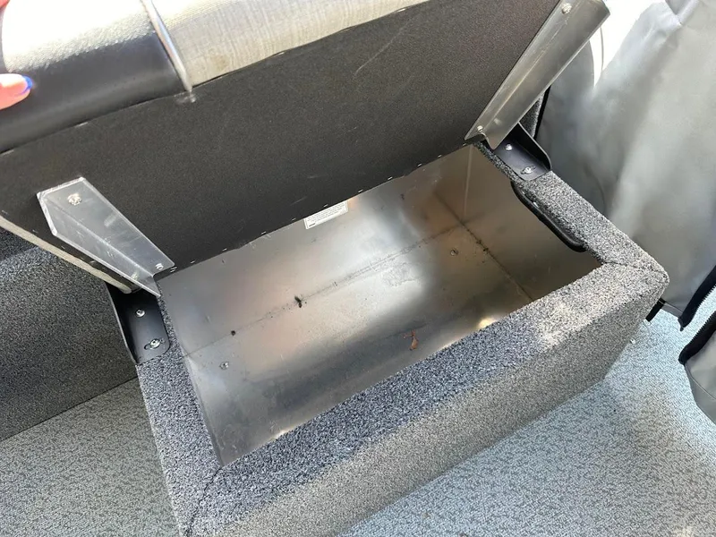Slide: The Image of Open storage compartment in 2023 Weldcraft 18 Angler Sport boat. - 24