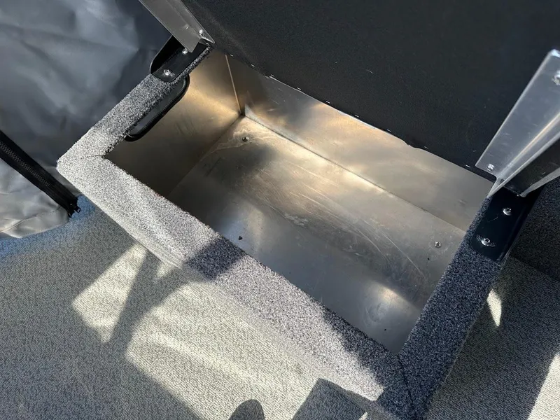Slide: The Image of Storage compartment in 2023 Weldcraft 18 Angler Sport boat, featuring durable metal interior. - 25