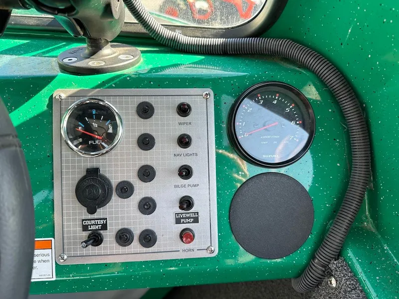 Slide: The Image of Control panel of 2023 Weldcraft 18 Angler Sport boat with gauges and switches. - 29