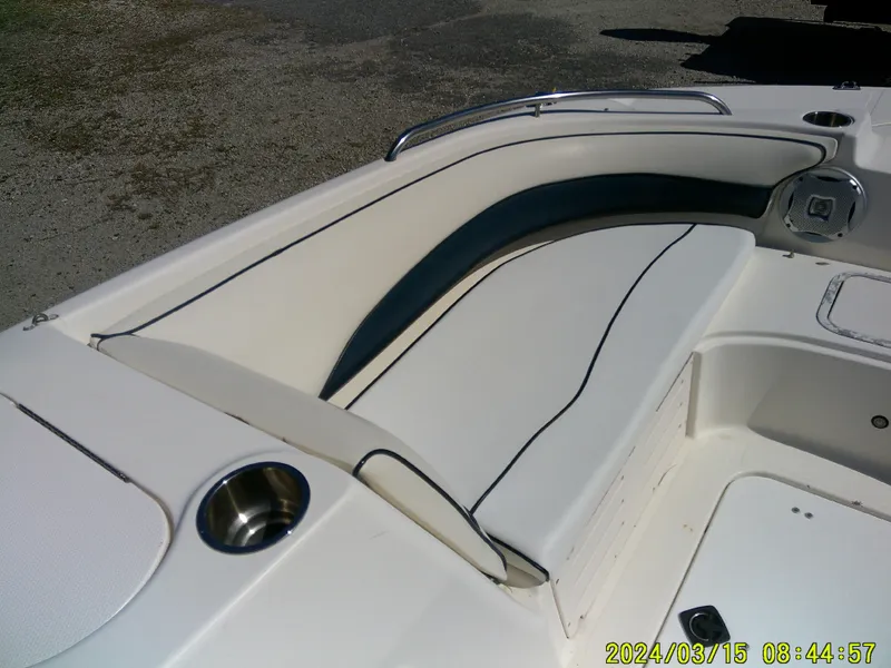 Slide: The Image of 2006 Hurricane Fun Deck 194 boat interior with white seating and cup holder. - 10