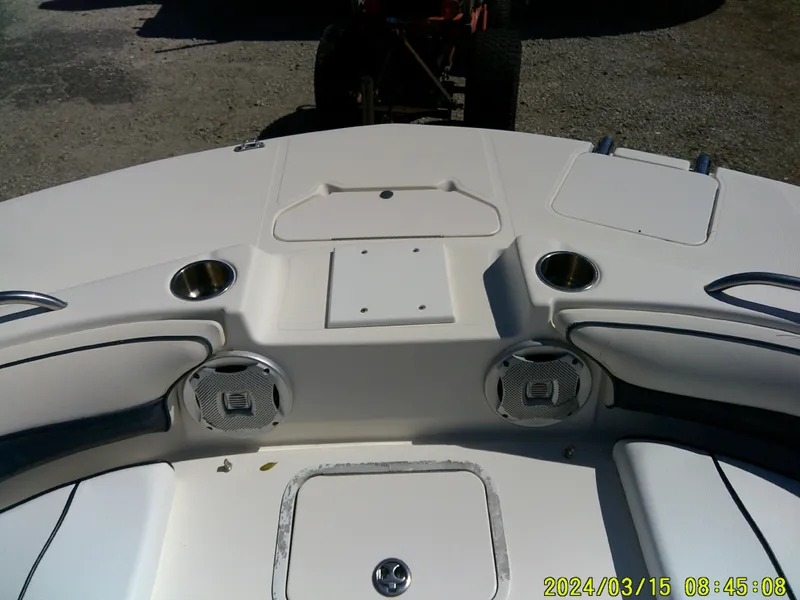 Slide: The Image of 2006 Hurricane Fun Deck 194 boat interior with cup holders and speakers. - 13