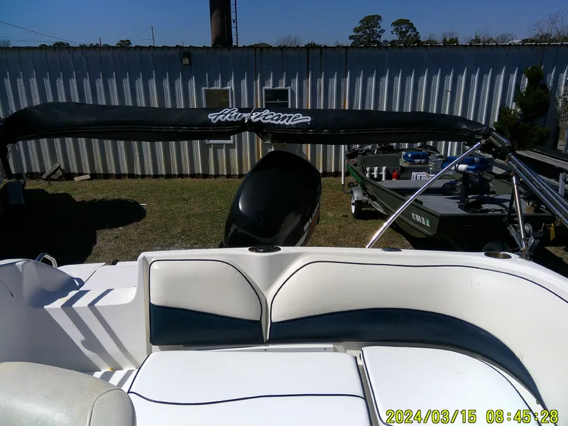Slide: The Image of 2006 Hurricane Fun Deck 194 boat with seating, photographed outdoors. - 16