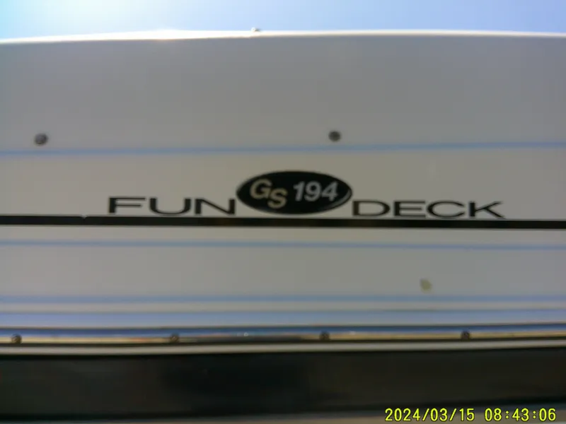 Slide: The Image of 2006 Hurricane Fun Deck 194 boat, white exterior with "GS 194" logo. - 5