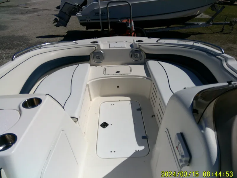 Slide: The Image of 2006 Hurricane Fun Deck 194 boat interior with seating and storage compartments. - 7