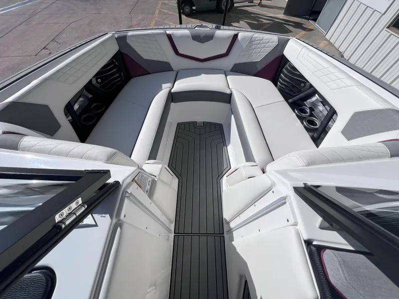 Slide: The Image of 2021 Nautique Super Air G23 boat interior with luxurious seating and modern design. - 13