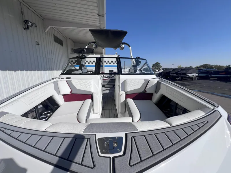 Slide: The Image of 2021 Nautique Super Air G23 boat with spacious seating and sleek design. - 3