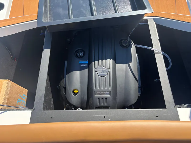 Slide: The Image of Engine compartment of 2025 Axis A225 boat, showcasing the engine and surrounding components. - 13