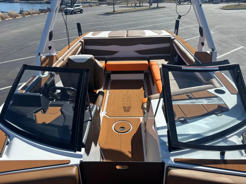 Slide: The Image of 2025 Axis A225 boat interior with open seating and modern dashboard design. - 7