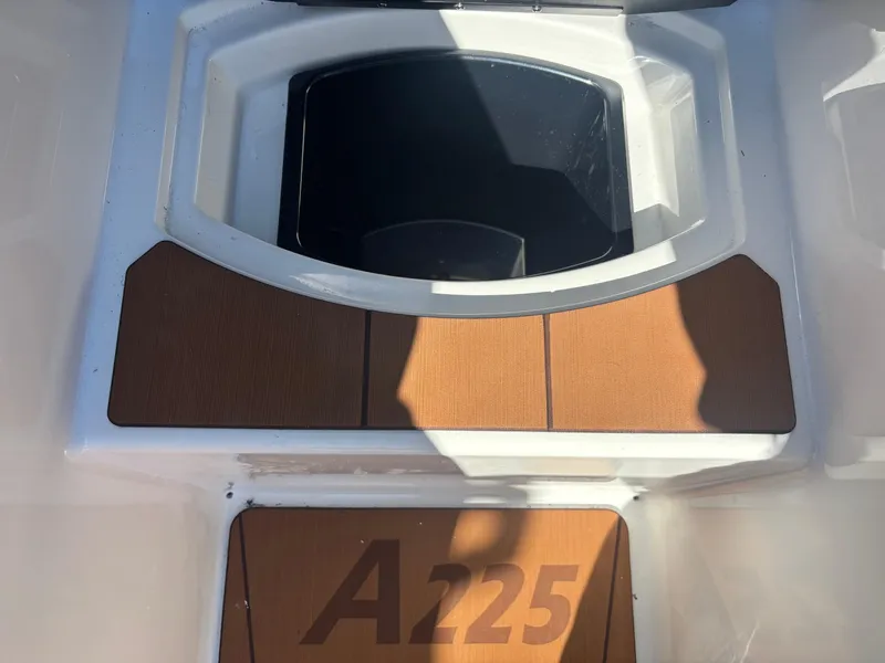 Slide: The Image of Axis A225 boat interior, 2025 model, featuring brown and white design elements. - 8