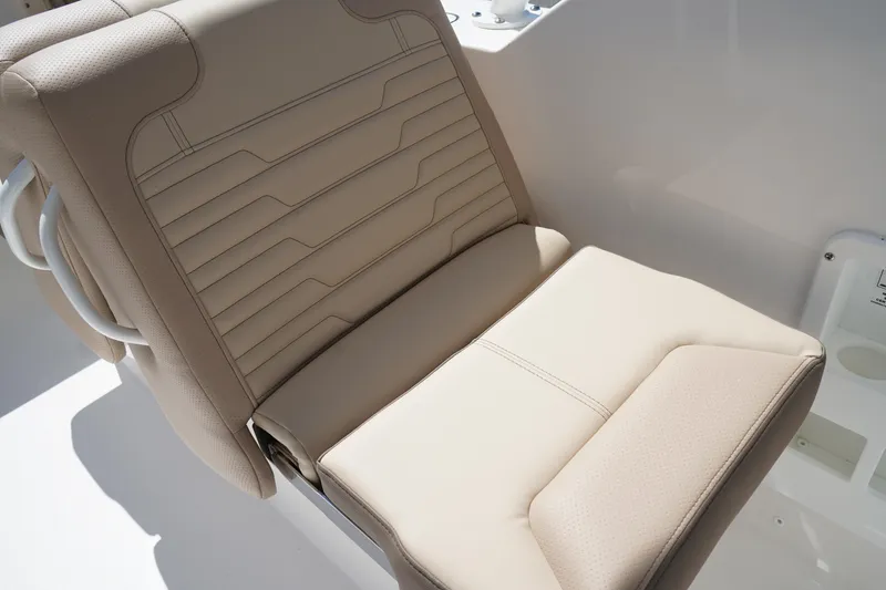 Slide: The Image of 2025 Edgewater 248 CX boat seat, beige upholstery, modern design. - 10