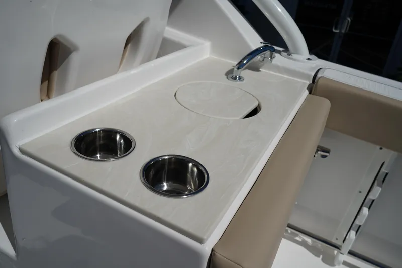 Slide: The Image of White Icon cooler in 2025 Edgewater 248 CX boat compartment. - 15